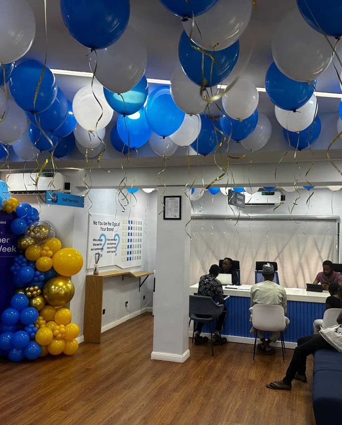Client office event with blue and white balloons
